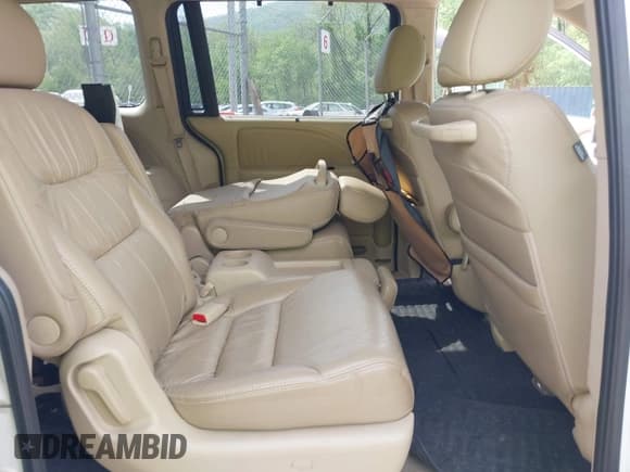 ✅ 2010 Honda Odyssey Touring • VIN: 5FNRL3H90AB039449 • Lot: 42032203. Listed on IAAI with 128,265 mi. Free auction sales archive from the USA and detailed vehicle history report at DreamBid. Image 8.