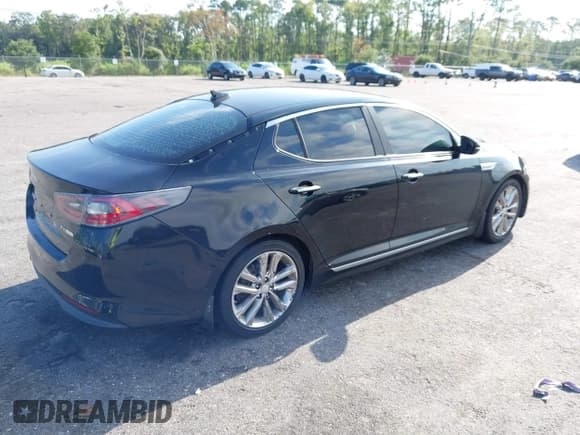 ✅ 2015 Kia Optima EX • VIN: KNAGN4AD7F5090393 • Lot: 42632332. Listed on IAAI with 205,227 mi. Free auction sales archive from the USA and detailed vehicle history report at DreamBid. Image 4.