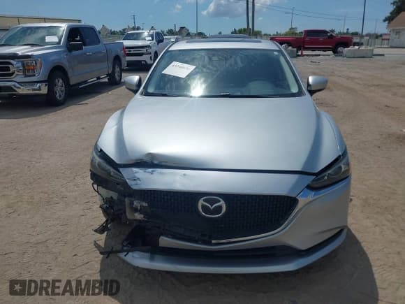 ✅ 2018 Mazda 6 Grand Touring • VIN: JM1GL1TY4J1318311 • Lot: 43240836. Listed on IAAI with 101,987 mi. Free auction sales archive from the USA and detailed vehicle history report at DreamBid. Image 13.