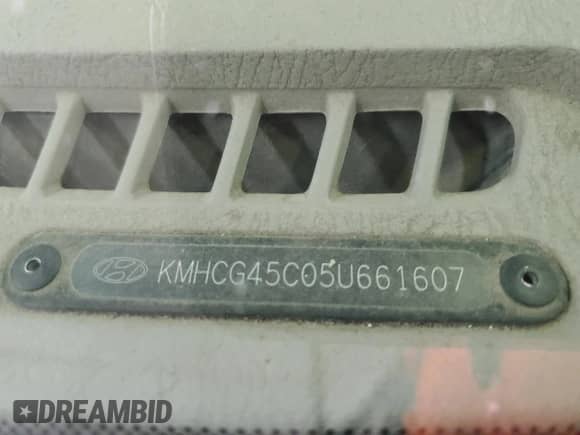 2005 Hyundai Accent GLS with VIN KMHCG45C05U661607, listed as a Copart auction lot 71812814 with 238,630 mi miles and Salvage title. Bid and sale history available at DreamBid. Image 12.