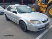 ✅ 2002 Mazda Protege DX • VIN: JM1BJ225820544033 • Лот: 43629175. Опубликован ранее на IAAI с пробегом 173 310 миль. Бесплатный доступ к архиву аукционных продаж из США и подробный отчёт об истории автомобиля на DreamBid. Изображение 1.