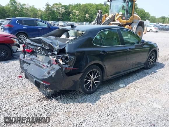 2023 Toyota Camry SE z VIN 4T1G11BKXPU101092, wystawiony jako IAAI lot #42396141 z przebiegiem 22 174 mil mil oraz . Historia ofert i sprzedaży dostępna na DreamBid. Obrazek 4.