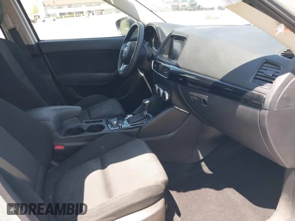 ✅ 2016 Mazda CX-5 Sport • VIN: JM3KE2BY5G0793032 • Lot: 42128706. Listed on IAAI with 52,010 mi. Free auction sales archive from the USA and detailed vehicle history report at DreamBid. Image 5.