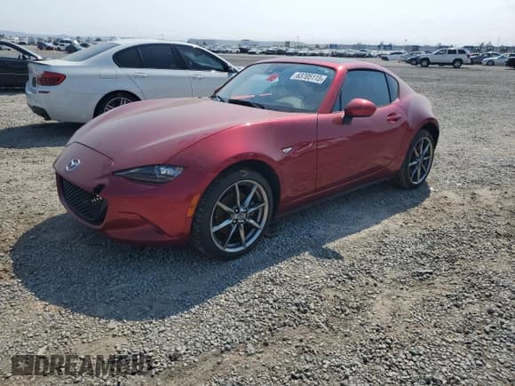 ✅ 2021 Mazda MX-5 Miata Grand Touring • VIN: JM1NDAM76M0454265 • Lot: 63705115. Listed on Copart with Not provided. Free auction sales archive from the USA and detailed vehicle history report at DreamBid. Image 1.