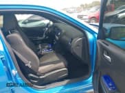 ✅ 2015 Dodge Charger SXT • VIN: 2C3CDXHG3FH827754 • Lot: 42012425. Listed on IAAI with 119,057 mi. Free auction sales archive from the USA and detailed vehicle history report at DreamBid. Image 5.