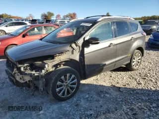 2017 Ford Escape Titanium с VIN 1FMCU9J98HUC40710, выставлен на аукционе Copart как лот 82381355 с пробегом 124 333 миль миль и Списание • Salvage title. История ставок и продаж доступна на DreamBid. Изображение 1.