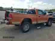 2001 Dodge Dakota Sport z VIN 1B7GG26N31S197440, wystawiony jako Copart lot #68280665 z przebiegiem Nie podano mil oraz Szkoda całkowita • Salvage title. Historia ofert i sprzedaży dostępna na DreamBid. Obrazek 3.