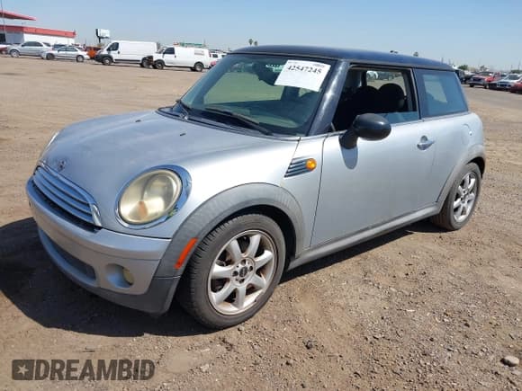✅ 2007 MINI Hardtop • VIN: WMWMF33547TL77235 • Lot: 42547245. Listed on IAAI with 144,179 mi. Free auction sales archive from the USA and detailed vehicle history report at DreamBid. Image 2.