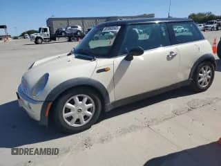 2004 MINI Hardtop with VIN WMWRC33494TJ59809, listed as a Copart auction lot 87088565 with 184,742 mi miles and Salvage title. Bid and sale history available at DreamBid. Image 1.