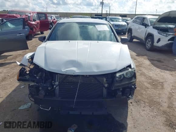 2014 Dodge Avenger SE with VIN 1C3CDZAGXEN219516, listed as a IAAI auction lot 43269201 with 82,987 mi miles and . Bid and sale history available at DreamBid. Image 13.