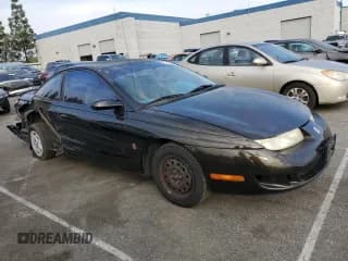 ✅ 1997 Saturn SC • VIN: 1G8ZF1286VZ350275 • Лот: 83010514. Опубликован ранее на Copart с пробегом 143 241 миль. Бесплатный доступ к архиву аукционных продаж из США и подробный отчёт об истории автомобиля на DreamBid. Изображение 4.
