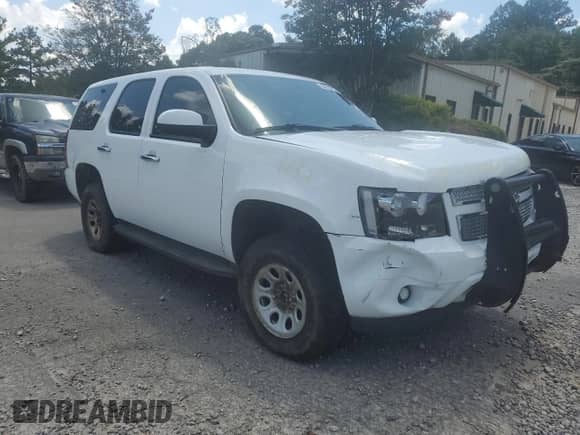 2011 Chevrolet Tahoe Commercial with VIN 1GNSK2E04BR328132, listed as a Copart auction lot 64219735 with 250,519 mi miles and Salvage title. Bid and sale history available at DreamBid. Image 4.
