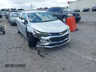 2017 Chevrolet Cruze Premier z VIN 3G1BF6SM0HS589624, wystawiony jako IAAI lot #42830755 z przebiegiem 105 702 mil mil oraz . Historia ofert i sprzedaży dostępna na DreamBid. Obrazek 1.
