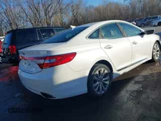 2014 Hyundai Azera z VIN KMHFG4JG6EA354949, wystawiony jako IAAI lot #41034372 z przebiegiem 173 338 mil mil oraz . Historia ofert i sprzedaży dostępna na DreamBid. Obrazek 4.