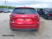 ✅ 2021 Mazda CX-5 Grand Touring • VIN: JM3KFBDM7M0357057 • Лот: 43110761. Опубликован ранее на IAAI с пробегом 66 576 миль. Бесплатный доступ к архиву аукционных продаж из США и подробный отчёт об истории автомобиля на DreamBid. Изображение 16.
