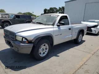 2002 Dodge Dakota z VIN 1B7FL16X62S658103, wystawiony jako Copart lot #59591785 z przebiegiem 157 808 mil mil oraz Szkoda całkowita • Salvage title. Historia ofert i sprzedaży dostępna na DreamBid. Obrazek 1.