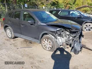✅ 2016 Mazda CX-5 Touring • VIN: JM3KE4CY5G0716056 • Lot: 43521281. Listed on IAAI with 107,968 mi. Free auction sales archive from the USA and detailed vehicle history report at DreamBid. Image 1.