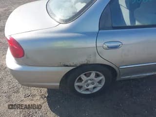 ✅ 2002 Kia Spectra • VIN: KNAFB121725124799 • Лот: 43080864. Опубликован ранее на IAAI с пробегом 87 823 миль. Бесплатный доступ к архиву аукционных продаж из США и подробный отчёт об истории автомобиля на DreamBid. Изображение 6.