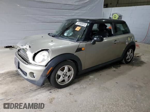 2010 MINI Hardtop with VIN WMWMF3C50ATZ66791, listed as a Copart auction lot 57592875 with Not provided miles and Salvage title. Bid and sale history available at DreamBid. Image 1.