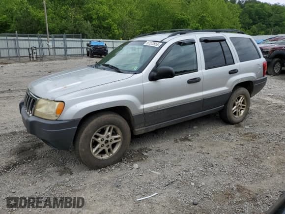 ✅ 2004 Jeep Grand Cherokee Laredo • VIN: 1J4GW48S34C184715 • Лот: 57272955. Опубликован ранее на Copart с пробегом 245 902 миль. Бесплатный доступ к архиву аукционных продаж из США и подробный отчёт об истории автомобиля на DreamBid. Изображение 1.