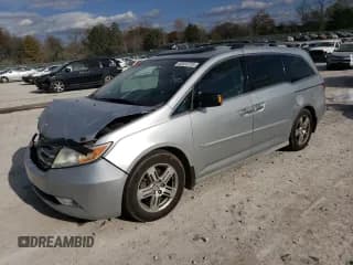 ✅ 2012 Honda Odyssey Touring • VIN: 5FNRL5H92CB110407 • Lot: 92023725. Listed on Copart with 257,068 mi. Free auction sales archive from the USA and detailed vehicle history report at DreamBid. Image 1.
