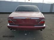 ✅ 2000 Jaguar XJ • VIN: SAJDA14C6YLF02910 • Lot: 52257155. Listed on Copart with 170,569 mi. Free auction sales archive from the USA and detailed vehicle history report at DreamBid. Image 6.