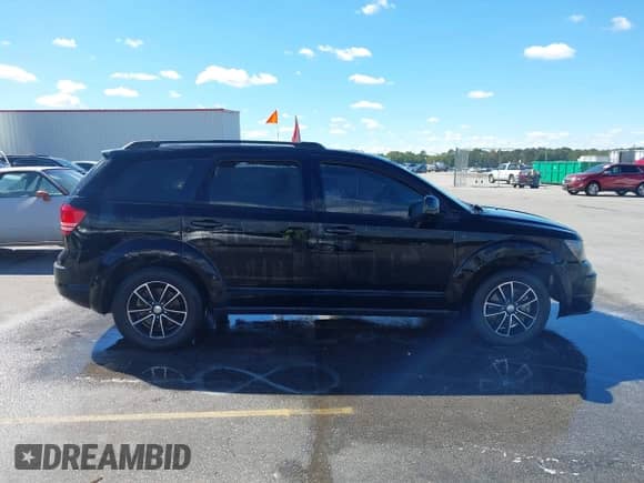 2017 Dodge Journey SE z VIN 3C4PDCAB4HT630221, wystawiony jako IAAI lot #43423577 z przebiegiem 126 030 mil mil oraz . Historia ofert i sprzedaży dostępna na DreamBid. Obrazek 13.