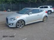 ✅ 2013 Hyundai Veloster Turbo • VIN: KMHTC6AE1DU177023 • Lot: 42604617. Listed on IAAI with 102,087 mi. Free auction sales archive from the USA and detailed vehicle history report at DreamBid. Image 2.