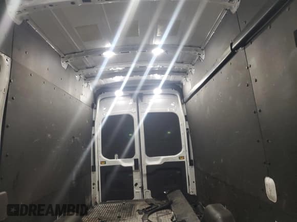 ✅ 2023 Ford Transit Cargo • VIN: 1FTBW3X83PKA13800 • Lot: 83735954. Listed on Copart with 37,252 mi. Free auction sales archive from the USA and detailed vehicle history report at DreamBid. Image 10.