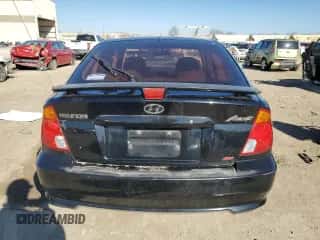 2005 Hyundai Accent GLS z VIN KMHCG35C05U352567, wystawiony jako Copart lot #49114555 z przebiegiem 77 847 mil mil oraz Szkoda całkowita • Salvage title. Historia ofert i sprzedaży dostępna na DreamBid. Obrazek 6.