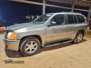 ✅ 2003 GMC Envoy SLE • VIN: 1GKDS13S032202560 • Лот: 94899885. Опубликован ранее на Copart с пробегом 310 178 миль. Бесплатный доступ к архиву аукционных продаж из США и подробный отчёт об истории автомобиля на DreamBid. Изображение 1.