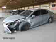 2021 Toyota Camry Hybrid LE with VIN 4T1C31AK5MU554381, listed as a Copart auction lot 69998775 with 104,313 mi miles and Salvage title. Bid and sale history available at DreamBid. Image 1.