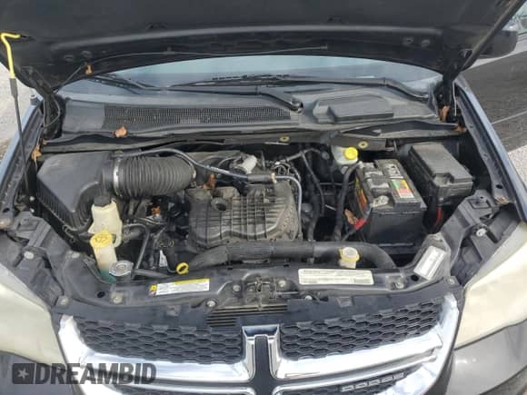 2012 Dodge Grand Caravan SXT z VIN 2C4RDGCG9CR198584, wystawiony jako Copart lot #87287765 z przebiegiem 189 694 mil mil oraz Szkoda całkowita • Salvage title. Historia ofert i sprzedaży dostępna na DreamBid. Obrazek 12.