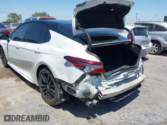 2021 Toyota Camry Hybrid XSE with VIN 4T1K31AK2MU020833, listed as a IAAI auction lot 42520233 with 86,176 mi miles and . Bid and sale history available at DreamBid. Image 3.