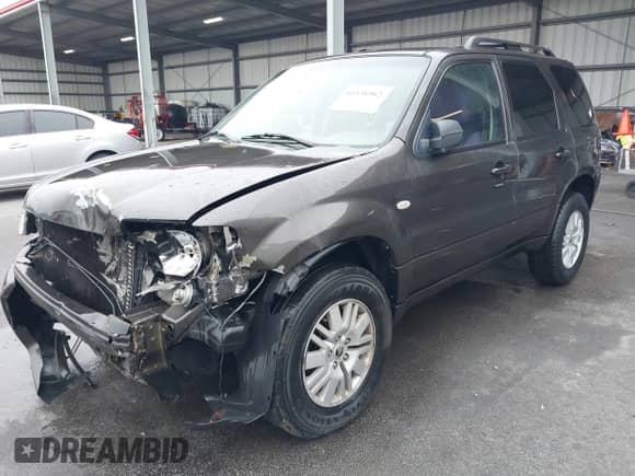 2005 Mercury Mariner Luxury z VIN 4M2YU56195DJ14917, wystawiony jako IAAI lot #41538962 z przebiegiem 210 486 mil mil oraz . Historia ofert i sprzedaży dostępna na DreamBid. Obrazek 2.