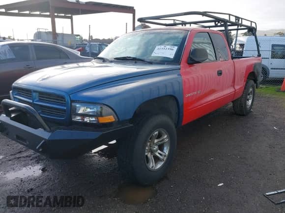 2002 Dodge Dakota SLT with VIN 1B7GL42N52S505626, listed as a IAAI auction lot 41552396 with 255,927 mi miles and . Bid and sale history available at DreamBid. Image 2.