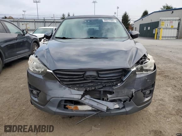 ✅ 2016 Mazda CX-5 Touring • VIN: JM3KE4CYXG0787043 • Lot: 90972585. Wystawiony na Copart z przebiegiem 99 074 mil. Bezpłatny archiwum sprzedaży aukcyjnych z USA i szczegółowy raport historii pojazdu na DreamBid. Zdjęcie 5.