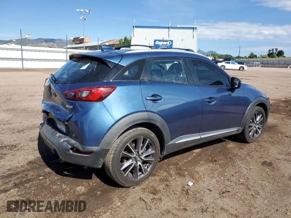 ✅ 2018 Mazda CX-3 Grand Touring • VIN: JM1DKDD78J0300462 • Лот: 64721235. Опубликован ранее на Copart с пробегом 65 198 миль. Бесплатный доступ к архиву аукционных продаж из США и подробный отчёт об истории автомобиля на DreamBid. Изображение 3.