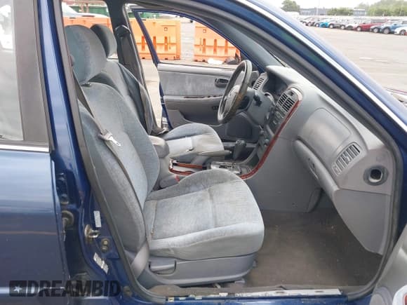 ✅ 2005 Kia Optima LX • VIN: KNAGD128455390068 • Lot: 42466140. Listed on IAAI with 128,832 mi. Free auction sales archive from the USA and detailed vehicle history report at DreamBid. Image 5.