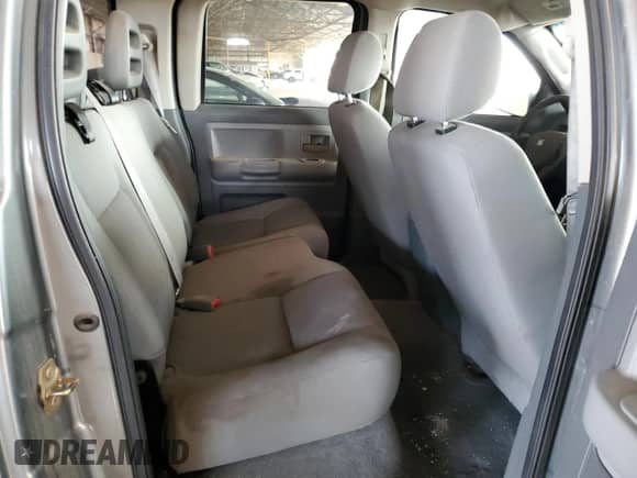 2006 Dodge Dakota SLT с VIN 1D7HE48K56S641262, выставлен на аукционе Copart как лот 71261245 с пробегом 133 008 миль миль и Чистый • Clean title. История ставок и продаж доступна на DreamBid. Изображение 10.