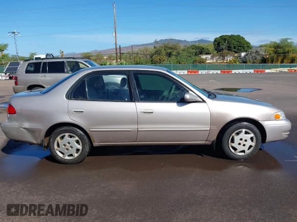 ✅ 2000 Toyota Corolla VE • VIN: 1NXBR12E0YZ361516 • Lot: 41366915. Listed on IAAI with 195,456 mi. Free auction sales archive from the USA and detailed vehicle history report at DreamBid. Image 13.
