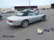 ✅ 2003 Jaguar XK • VIN: SAJDA42C232A34869 • Lot: 42058494. Listed on IAAI with 33,868 mi. Free auction sales archive from the USA and detailed vehicle history report at DreamBid. Image 4.