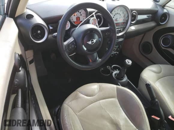 2012 MINI Hardtop with VIN WMWSU3C52CT367682, listed as a Copart auction lot 63045965 with 124,683 mi miles and Salvage title. Bid and sale history available at DreamBid. Image 8.