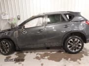 ✅ 2016 Mazda CX-5 Grand Touring • VIN: JM3KE4DY4G0679077 • Lot: 43560857. Wystawiony na IAAI z przebiegiem 83 348 mil. Bezpłatny archiwum sprzedaży aukcyjnych z USA i szczegółowy raport historii pojazdu na DreamBid. Zdjęcie 15.