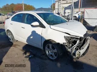 ✅ 2014 Chevrolet Sonic LTZ • VIN: 1G1JE5SB5E4227873 • Lot: 43452658. Listed on IAAI with 137,830 mi. Free auction sales archive from the USA and detailed vehicle history report at DreamBid. Image 1.