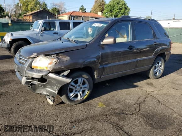 ✅ 2007 Kia Sportage EX • VIN: KNDJE723477311325 • Лот: 68219425. Опубликован ранее на Copart с пробегом 241 397 миль. Бесплатный доступ к архиву аукционных продаж из США и подробный отчёт об истории автомобиля на DreamBid. Изображение 1.