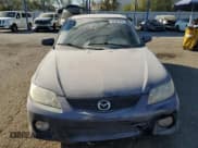 ✅ 2002 Mazda Protege • VIN: JM1BJ245921501313 • Lot: 74797214. Wystawiony na Copart z przebiegiem 241 536 mil. Bezpłatny archiwum sprzedaży aukcyjnych z USA i szczegółowy raport historii pojazdu na DreamBid. Zdjęcie 5.