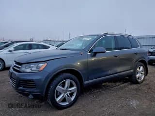 ✅ 2011 Volkswagen Touareg Sport • VIN: WVGFK9BPXBD003935 • Lot: 93716145. Listed on Copart with 113,109 mi. Free auction sales archive from the USA and detailed vehicle history report at DreamBid. Image 1.