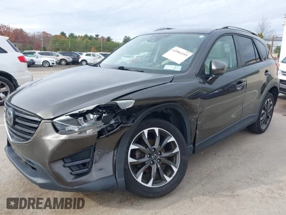 ✅ 2016 Mazda CX-5 Grand Touring • VIN: JM3KE4DY6G0672342 • Lot: 43581193. Wystawiony na IAAI z przebiegiem 94 680 mil. Bezpłatny archiwum sprzedaży aukcyjnych z USA i szczegółowy raport historii pojazdu na DreamBid. Zdjęcie 6.