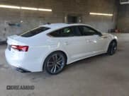 ✅ 2023 Audi A5 Sportback S line Premium Plus • VIN: WAUFACF5XPA069372 • Лот: 56223724. Опубликован ранее на Copart с пробегом 9 024 миль. Бесплатный доступ к архиву аукционных продаж из США и подробный отчёт об истории автомобиля на DreamBid. Изображение 3.